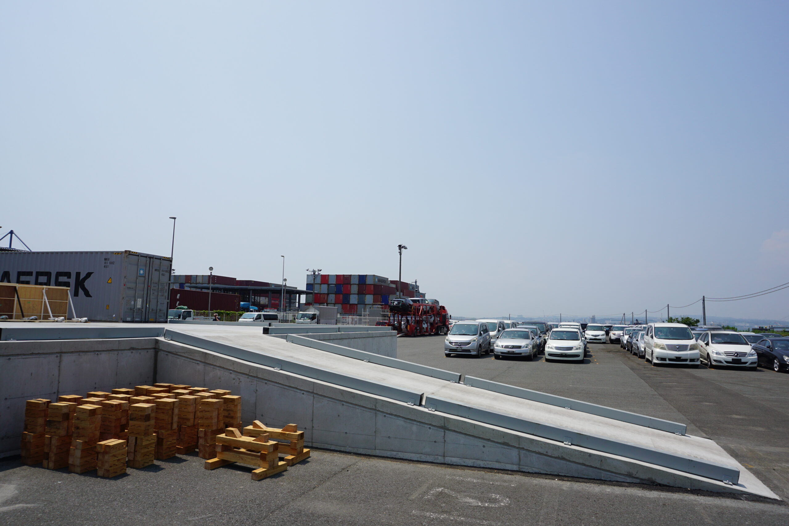 Used cars waiting to be loaded at the Minami Honmoku Vanning Yard 
